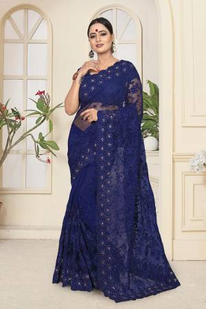 Enhance Your Personality In This Heavy And Attractive Looking Designer Saree In Royal Blue Color. This Saree And Blouse are Net Based Beautified With Tone To Tone Resham Embroidery And Ceramic Stone Work
