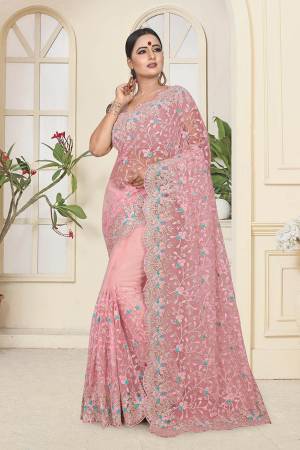 Look Pretty In This Very Beautiful Designer Net Based Saree In Pink Color. This Pretty Saree And Blouse Are Beautified With Contrasting Colored Resham And Ceramic Stone Work. Buy Now.