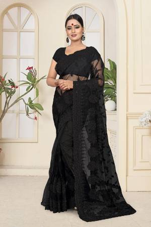 Here Is A Very Beautiful Heavy Embroidered Designer Saree In Black Color. This Saree And Blouse are Fabricated On Net Beautified With Tone To Tone Heavy Resham Embroidery With Ceramic Stone Work. Its Embroidery Gives Heavy And Subtle Look To Your Personality Both At The Same Time