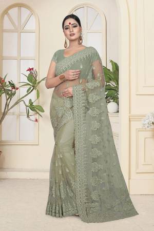 Look Pretty In This Very Beautiful Designer Net Based Saree In Pastel Green Color. This Pretty Saree And Blouse Are Beautified With Tone To Tone Resham And Ceramic Stone Work. Buy Now