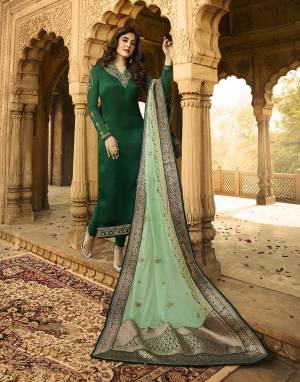 Go With The Pretty Shades Of Green With This Designer Straight Suit In Dark Green Color Paired With Light Green Colored Dupatta. Its Top IS Fabricated On Satin Georgette Paired With Santoon Bottom And Georgette Dupatta Highlighted With Jacquard Silk Borders. 