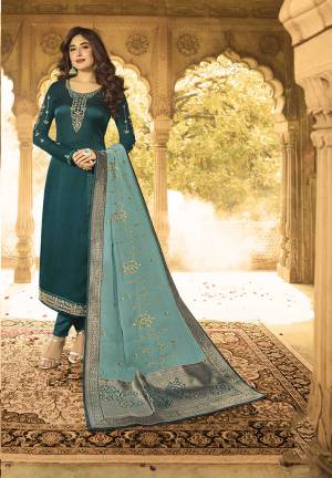 New And Unique Shade Is Here With This Designer Straight Suit In Prussian Blue Color Paired With Contrasting Light Blue Colored Dupatta. Its Embroidered Top Is Satin Georgette Based Paired With Santoon Bottom And Georgette Fabricated Dupatta. Its Pretty Dupatta Is Beautified With Embroidery And Jacquard Silk Fabricated Broad Borders. 