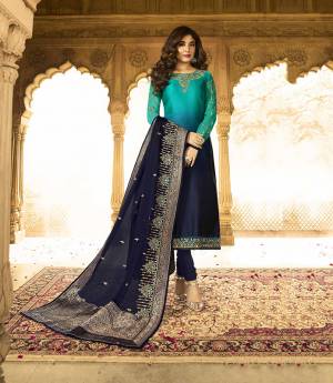Shaded Dress Can Never Go Out Of Style, So Grab This Evergreen Patterned Designer Straight Suit In Shades Of Blue Paired With Navy Blue Colored Bottom And Dupatta. Its Top IS Fabricated On Satin Georgette Paired With Santoon Bottom And Georgette And Jacquard Silk Dupatta. Buy Now.