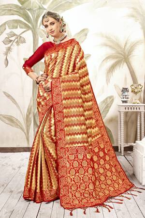 Celebrate This Festive Season In Proper Traditional Wear With This Silk Based Saree In Red Color . This Saree And Blouse Are Fabricated On Art Silk Beautified With Geometric Weave All Over. Its Fabric Is Light Weight, Durable And Easy To Care For. 
