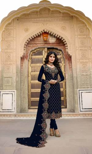 Get Ready For The Upcoming Festive And Wedding Season With This Heavy Designer Straight Suit In All Over Navy Blue Color. Its Heavy Embroidered Top And Dupatta are Fabricated On Georgette Paired With Santoon Fabricated Bottom. Its Contrasting Embroidery And Stone Work Is Giving A More Enhnaced And Attractive Look. 