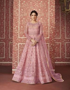 Catch All The Limelight This Wedding Season Wearing This Heavy Designer Floor Length Suit In Pink Colored Top, Bottom And Dupatta. Its Heavy Embroidered Top Is Fabricated On Net Paired With Satin Bottom and Net Fabricated Dupatta. Its Pretty Embroidery Gives A Heavy And Subtle Look Both At The Same Time. Buy Now.