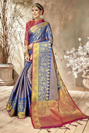 Add This Very Pretty Silk Based Saree To Your Wardrobe With Golden Highlight. This Saree Is Fabricated On Art Silk Paired With Art Silk Fabricated Blouse. It Is Beautified With Heavy Weave All Over It.