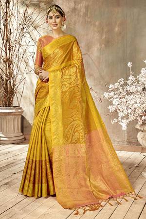 Add This Very Pretty Silk Based Saree To Your Wardrobe With Golden Highlight. This Saree Is Fabricated On Art Silk Paired With Art Silk Fabricated Blouse. It Is Beautified With Heavy Weave All Over It.