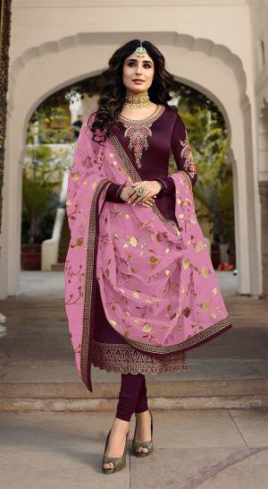 Grab This Heavy Designer Straight Cut Suit With Pretty Attractive Dupatta. This Suit Is In Wine Color Paired With Contrasting Pink Colored Dupatta. Its Top Is Fabricated On Satin Georgette Paired With Santoon Bottom And Georgette Fabricated Dupatta. It Is Beautified With Heavy Embroidery Over Top And Dupatta. 