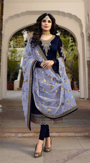 Grab This Heavy Designer Straight Cut Suit With Pretty Attractive Dupatta. This Suit Is In Navy Blue Color Paired With Contrasting Steel Blue Colored Dupatta. Its Top Is Fabricated On Satin Georgette Paired With Santoon Bottom And Georgette Fabricated Dupatta. It Is Beautified With Heavy Embroidery Over Top And Dupatta. 