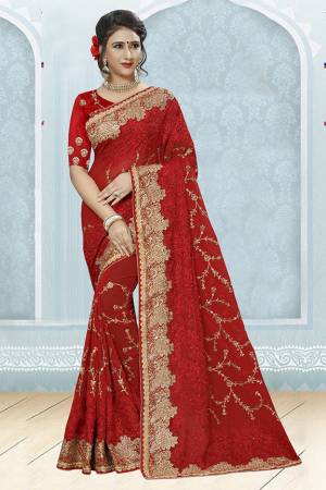Adorn The Pretty Angelic Look In This Lovely Red Colored Designer Saree. This Saree Is Fabricated On Georgette Paired With Art Slk Fabricated Blouse. It IS Beautified With Heavy Resham And Jari Embroidery With Stone Work. 