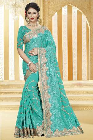 Look Pretty In This Heavy Designer Saree In Turquoise Blue Color Paired With Turquoise Blue Colored Blouse. This Saree Is Fabricated On Georgette Paired With Art Silk Fabricated Blouse. Buy Now.