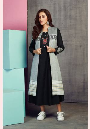 Add This Designer Jacket Patterned Readymade Kurti To Your Wardrobe In Black And Grey Color. It Is Fabricated On Handloom Cotton Beautified With Prints And Thread Work. 