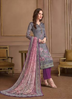 Here Is Pretty Printed Designer Suit In Grey And Purple Color. This Suit Is Satin Georgette Based Paired With Crepe Bottom And Georgette Fabricated Dupatta. It Is Beautified With Prints All Over.