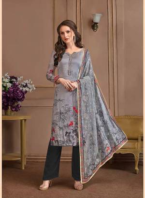Here Is Pretty Printed Designer Suit In Grey And Dark Grey Color. This Suit Is Satin Georgette Based Paired With Crepe Bottom And Georgette Fabricated Dupatta. It Is Beautified With Prints All Over.