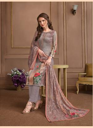 Here Is Pretty Printed Designer Suit In Grey And Mauve Color. This Suit Is Satin Georgette Based Paired With Crepe Bottom And Georgette Fabricated Dupatta. It Is Beautified With Prints All Over.
