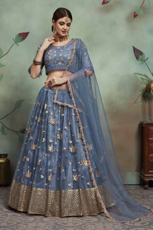 New And Unqiue Shade Is Here With This Heavy Designer Lehenga Choli In Steel Blue Color. This Lehenga Choli And Dupatta Are Fabricated On Soft Net Beautified With Elegant Embroidery Work Which Gives A Rich And Subtle Look. 