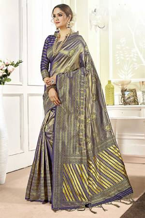 Add This Very Pretty Silk Based Saree To Your Wardrobe In Violet Color. This Saree Is Fabricated On Banarasi Art Silk Paired With Art Silk Fabricated Blouse. It Is Beautified With Floral Weave All Over It