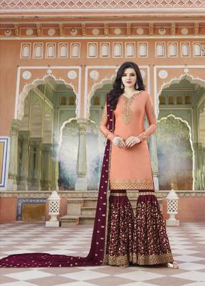 Pretty Unique Combination Is Here With This Heavy Designer Sharara Suit In Peach Colored Top Paired With Contrasting Maroon Colored Bottom And Dupatta. Its Top And Bottom Are Fabricated On Satin Paired With Georgette Fabricated Dupatta. Buy Now.