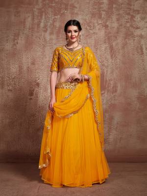 Celebrate This Festive Season With Beauty And Comfort Wearing This Light Weight Designer Lehenga Choli In All Over Musturd Yellow Color. Its Pretty Embroidered Blouse Is Fabricated On Art Silk Paired With Net Fabricated Lehenga And Dupatta. Buy Now.
