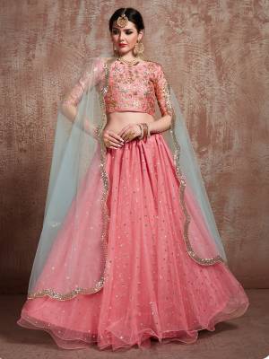 This Wedding Season, Look The Most Attractive Of All Weading This Heavy Designer Lehenga Choli In Pink Color Paired With Contrasting Grey Colored Dupatta. Its Blouse Is Fabricated On Art Silk Paired With Net Fabricated Lehenga And Dupatta. Buy Now.