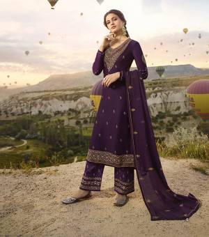 Here Is A Very Pretty Heavy Designer Straight Suit In Purple Color Paired With Purple Colored Bottom And Dupatta. Its Embroidered Top Is Fabricated On Satin Georgette Paired With Santoon Bottom And Georgette Dupatta. Buy This Suit Now.