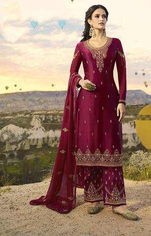 Here Is A Very Pretty Heavy Designer Straight Suit In Magenta Pink Color Paired With Magenta Pink Colored Bottom And Dupatta. Its Embroidered Top Is Fabricated On Satin Georgette Paired With Santoon Bottom And Georgette Dupatta. Buy This Suit Now.