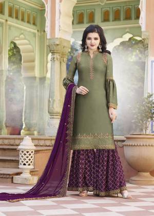 Grab This Very Pretty Heavy Designer Plazzo Suit In Olive Green Colored Top Paired With Magenta Pink Colored Bottom and Dupatta. Its Top And Bottom Are Satin Based Paired With Georgette Fabricated Dupatta. All Three Piece Are Beautified With Heavy Embroidery. 