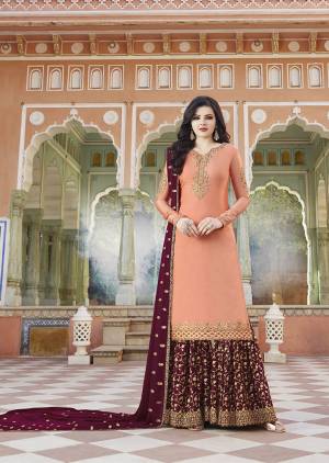 Pretty Unique Combination Is Here With This Heavy Designer Plazzo Suit In Peach Colored Top Paired With Contrasting Maroon Colored Bottom And Dupatta. Its Top And Bottom Are Fabricated On Satin Paired With Georgette Fabricated Dupatta. Buy Now.