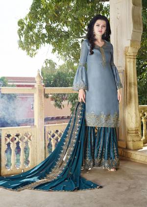 Go With The Pretty Shades Of Blue With This Heavy Designer Plazzo Suit In Light Blue Colored Top Paired With Blue Colored Bottom And Dupatta. Its Top And Bottom are Satin Based Paired With Georgette Fabricated Dupatta. Its Top , bottom And Dupatta Are Beautified With Heavy Attractive Embroidery. 