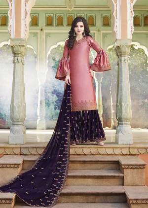 You Will Definitely Earn Lots Of Compliments Wearing This Pretty Girly Color Pallete In Pink Colored Top Paired With Contrasting Dark Purple Colored Bottom And Dupatta. This Heavy Embroidered Plazzo Suit Is Fabricated On Satin Paired With Georgette Fabricated Dupatta. 