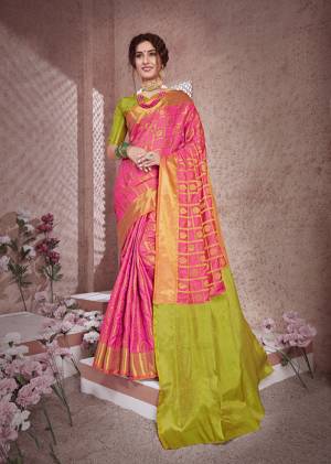 Look Pretty In This Silk Based Saree In Pink Color Paired With Contrasting Olive Green Colored Blouse. This Saree And Blouse Are Fabricated On Banarasi Art Silk Beautified With Weave All Over. 