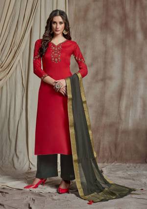 Here Is Rich And Elegant Looking Designer Straight Suit Is Here In Red Color Paired With Contrasting Grey Colored Bottom and Dupatta. Its Top Is Fabricated On Soft Silk Beautified With Resham Work Paired With Satin Fabricated Bottom And Banarasi Art Silk Dupatta. 