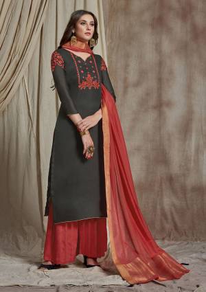 Enhance Your Personality Wearing This Designer Straight Suit In Dark Grey Colored Top Paired With Crimson Red Colored Bottom And Dupatta. Its Embroidered Top Is Fabricated On Soft Silk Paired With Satin Bottom And Banarasi Art Silk Dupatta. Its Fabrics Are Light Weight And Easy To Carry All Day Long. 