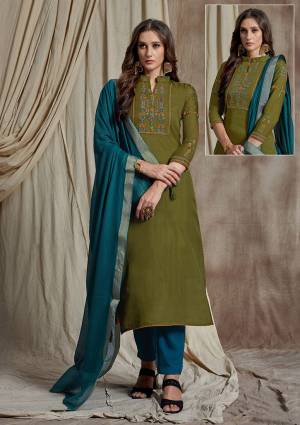 You Will Definitely Earn Lots Of Compliments Wearing This Designer Straight Cut Suit In Olive Green Colored Top Paired With Contrasting Blue Colored Bottom And Dupatta. Its Top Is Fabricated On Soft Silk Paired With Satin Bottom And Banarasi Art Silk Dupatta. 
