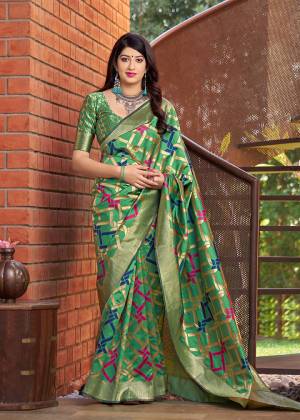 Grab This Pretty Designer Silk Based Saree In Green Color Paired With Green Colored Blouse. This Saree And Blouse Are Fabricated On Banarasi Art Silk Beautified With Weave All Over. 