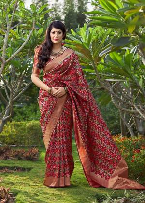 Add This Beautiful Saree To Your Wardrobe In Red Color Paired With Red Colored Blouse. This Saree And Blouse Are Fabricated On Banarasi Art Silk Beautified With Weave All Over. It Is Light Weight And Easy To Drape. 