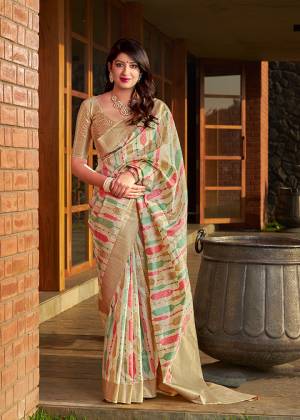 Celebrate This Festive Season In A Traditional Look Wearing This Designer Silk Based Saree In Cream Color. This Saree And Blouse Are Fabricated On Banarasi Art Silk Beautified With Weave All Over. 