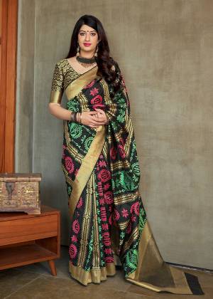 Add This Beautiful Saree To Your Wardrobe In Black Color Paired With Black & Gold Colored Blouse. This Saree And Blouse Are Fabricated On Banarasi Art Silk Beautified With Weave All Over. It Is Light Weight And Easy To Drape. 