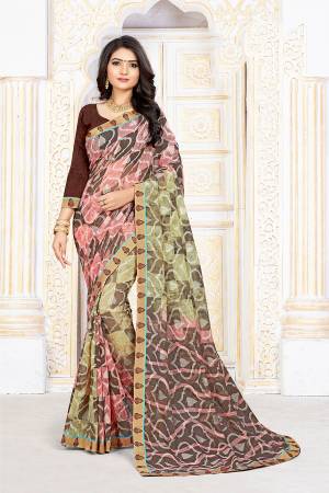 Lokk Pretty In This Multi Colored Saree Paired With Brown Colored Blouse. This Saree Is Fabricated On Chiffon Brasso Paired With Art Silk Fabricated Blouse. Its Fabrics Are Soft Towards Skin And Durable. 