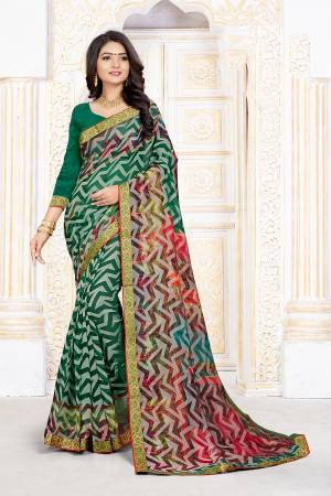 Lokk Pretty In This Green Colored Saree Paired With Green Colored Blouse. This Saree Is Fabricated On Chiffon Brasso Paired With Art Silk Fabricated Blouse. Its Fabrics Are Soft Towards Skin And Durable. 