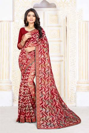 For Your Semi-Casuals, Grab This Pretty Printed Saree In Red Color Paired With Red Colored Blouse. This Saree Is Fabricated On Chiffon Brasso Paired With Art Silk Fabricated Blouse. It Is Light Weight And Easy To Carry All Day Long. 