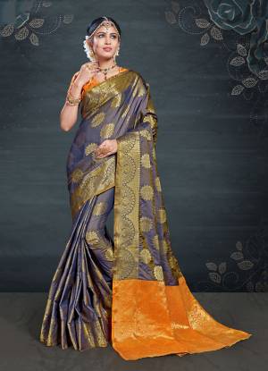 Celebrate This Festive Season With Beauty And Comfort Wearing This Designer Saree In Navy Blue Color Paired With Contrasting Orange Colored Blouse. This Saree And Blouse Are Fabricated On Banarasi Art Silk Beautified With Weave All Over. It Is Light Weight And Easy To Drape. Buy Now.