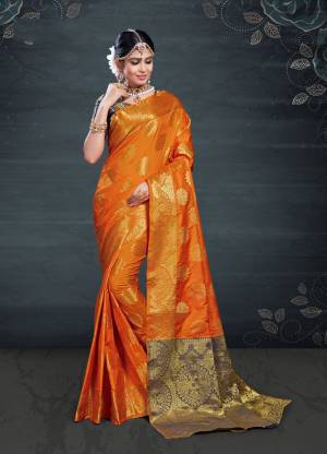 Adorn A Proper Traditional Look Wearing This Designer Silk Based Saree In Orange Color. This Pretty Saree And Blouse Are Fabricated On Banarasi Art Silk Beautified With Weave All Over. 