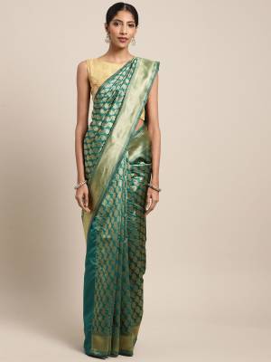 Celebrate This Festive Season In Traditional Look Wearing This Silk Based Saree In Teal Green Color. This Saree And Blouse are Fabricated On Art Silk Beautified With Weave All Over. 