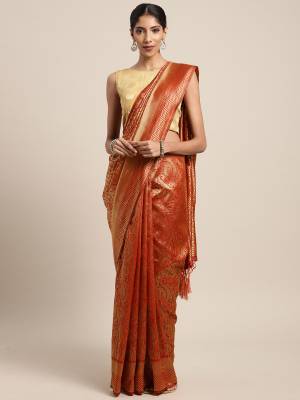 Celebrate This Festive Season In Traditional Look Wearing This Silk Based Saree In Orange Color. This Saree And Blouse are Fabricated On Art Silk Beautified With Weave All Over. 