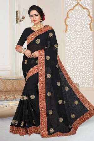 Grab This Beautiful Heavy Designer Saree In Black Color Paired With Black Colored Blouse. This Saree And Blouse are Fabricated On Georgette Beautified With Jari And Tone To Tone Resham Embroidery With Stone Work.  Buy This Saree Now. 