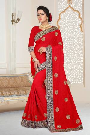 Grab This Beautiful Heavy Designer Saree In Red Color Paired With Red Colored Blouse. This Saree And Blouse are Fabricated On Georgette Beautified With Jari And Tone To Tone Resham Embroidery With Stone Work.  Buy This Saree Now. 