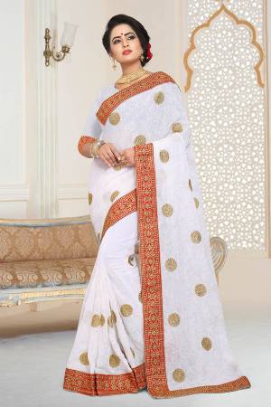 Grab This Beautiful Heavy Designer Saree In White Color Paired With White Colored Blouse. This Saree And Blouse are Fabricated On Georgette Beautified With Jari And Tone To Tone Resham Embroidery With Stone Work.  Buy This Saree Now. 