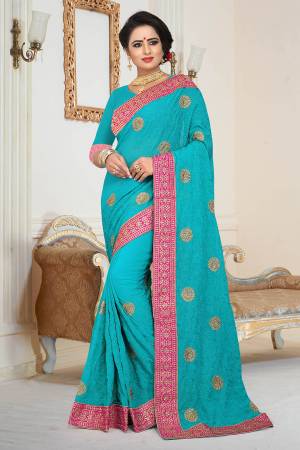Grab This Beautiful Heavy Designer Saree In Blue Color Paired With Blue Colored Blouse. This Saree And Blouse are Fabricated On Georgette Beautified With Jari And Tone To Tone Resham Embroidery With Stone Work.  Buy This Saree Now. 